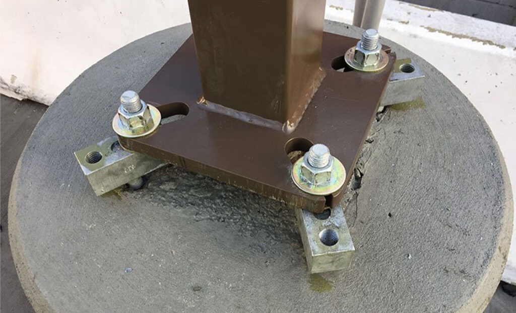 Lightning foundation anchors secure surge protection structures
