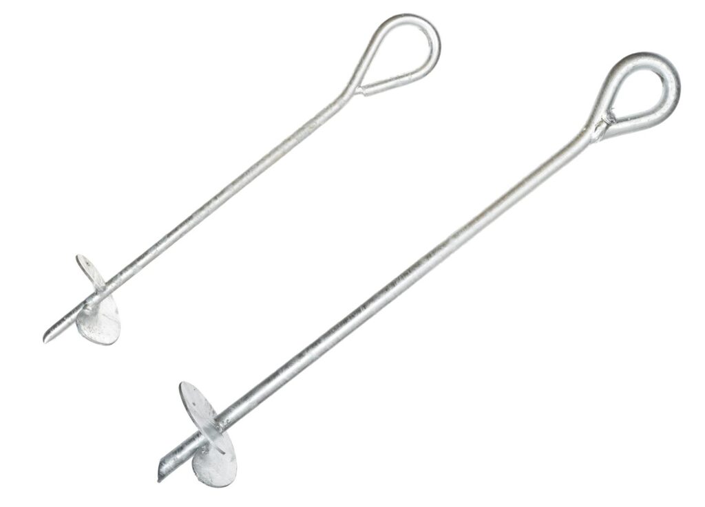 Helical anchor resist tension by transferring loads